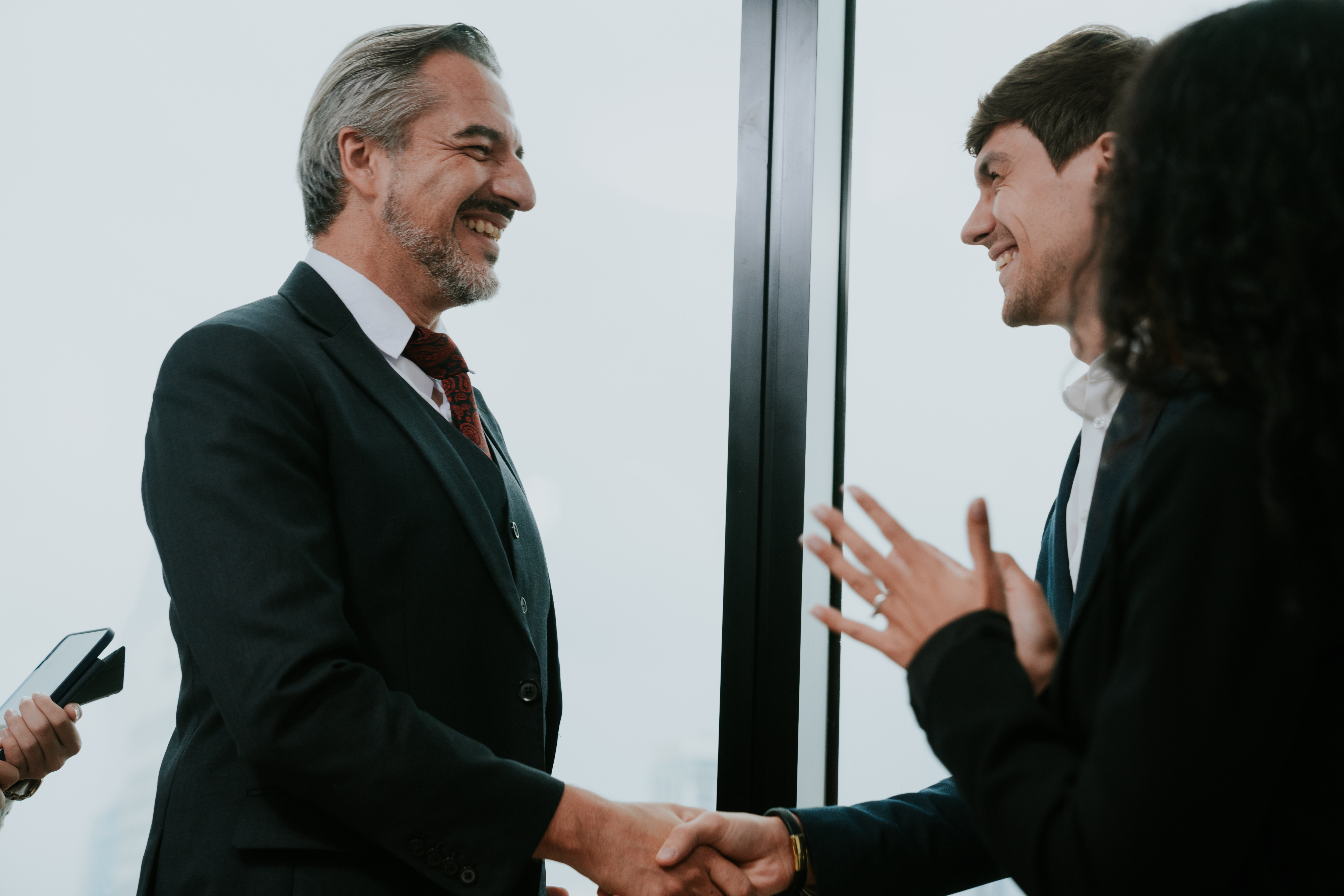 Rutter Mills attorneys greeting a client
