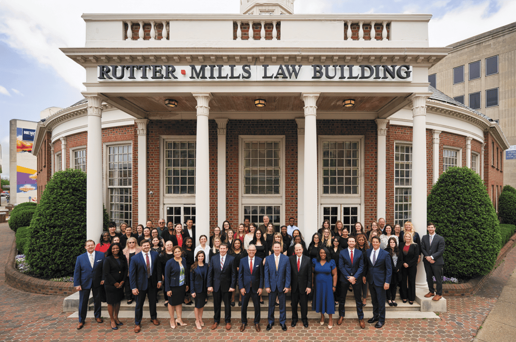 The Rutter Mills team outside the Rutter Mills Law Building